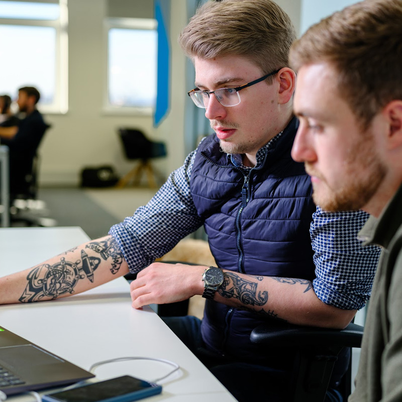 Charlie and Ben working on custom ecommerce solution Charlie and Ben working on custom ecommerce solution