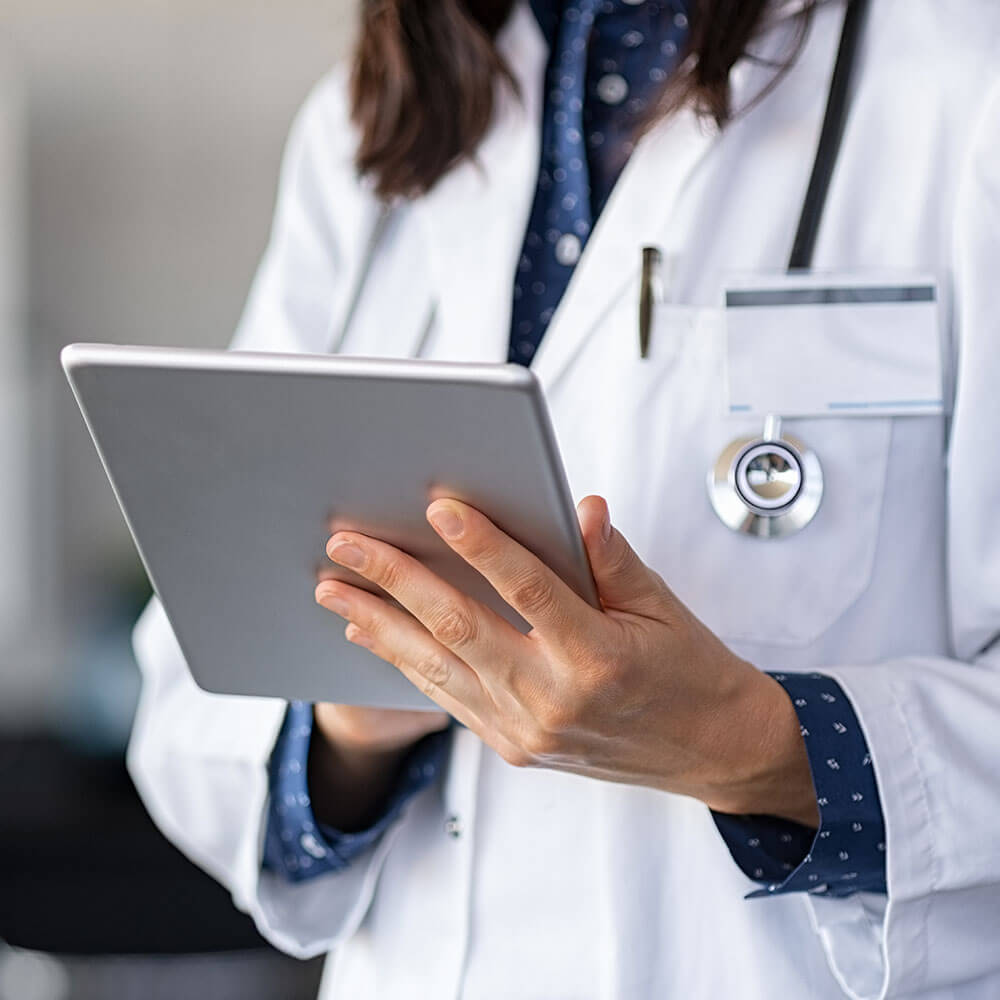 HIS Integration - Medical woman working on tablet device HIS Integration - Medical woman working on tablet device